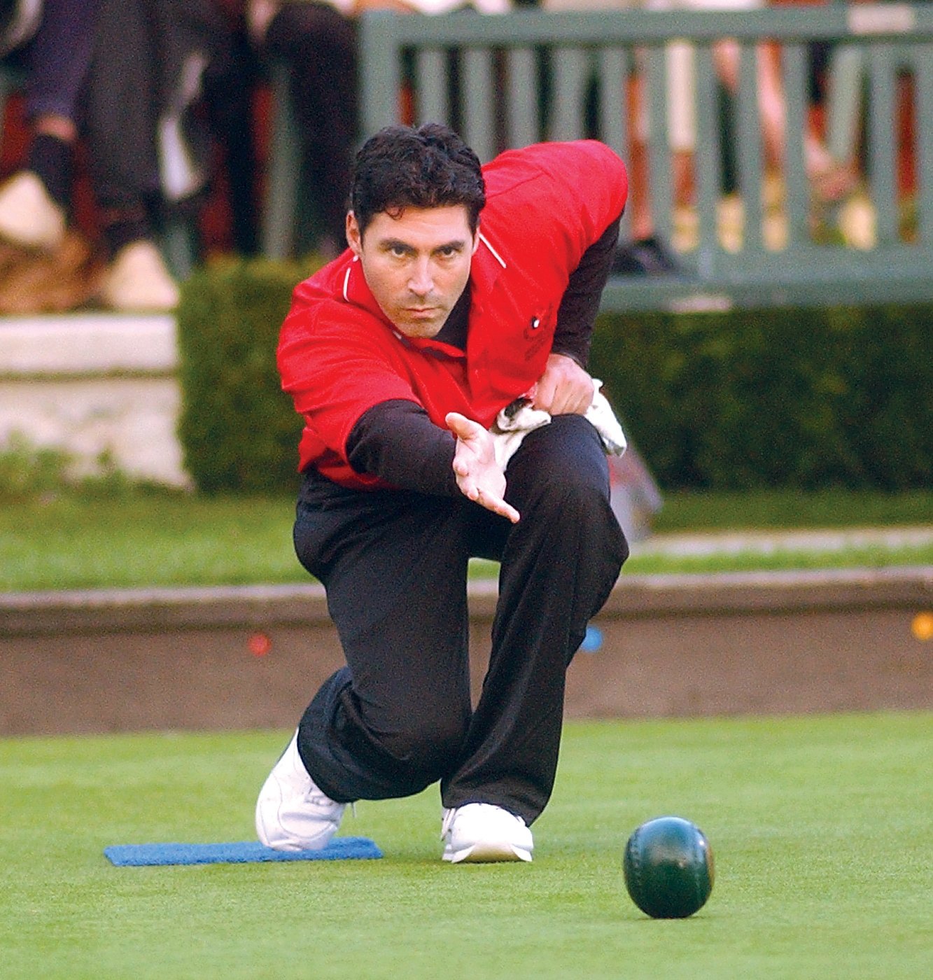 A lawn bowls player delivering a bowl during a match, generic file photo of the sport