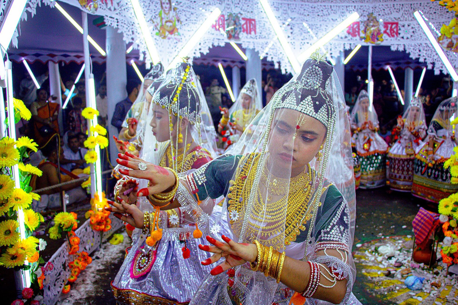Dancers in traditional Manipuri Ras Leela costume performing at a festival in Kamalganj, Moulvibazar, Bangladesh